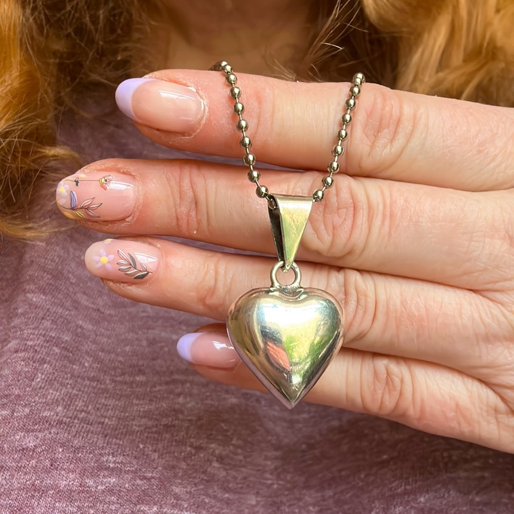 Sterling silver “comfort “ zen heart bell necklace.  Shake or rub for healing